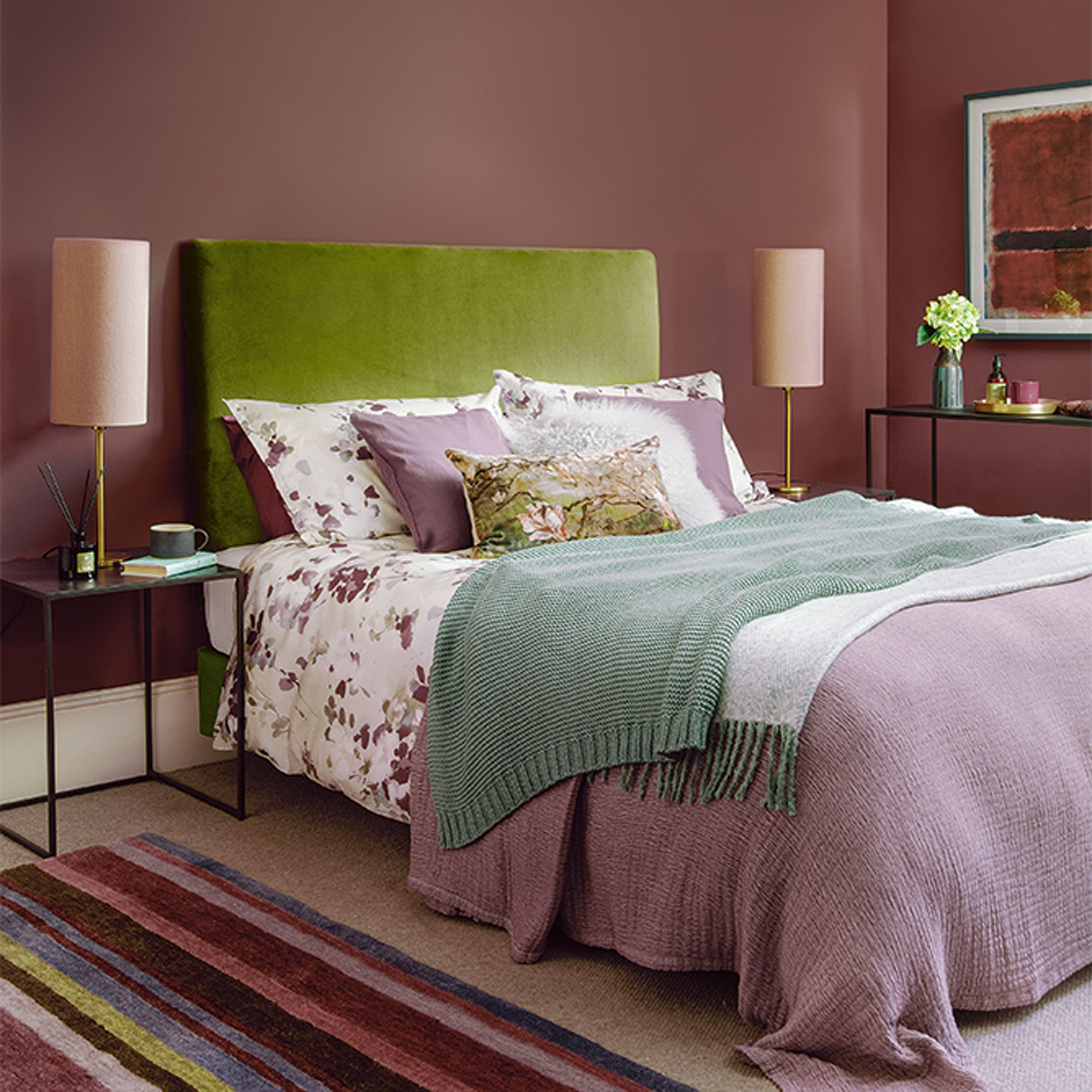 plum bedroom with green headboard