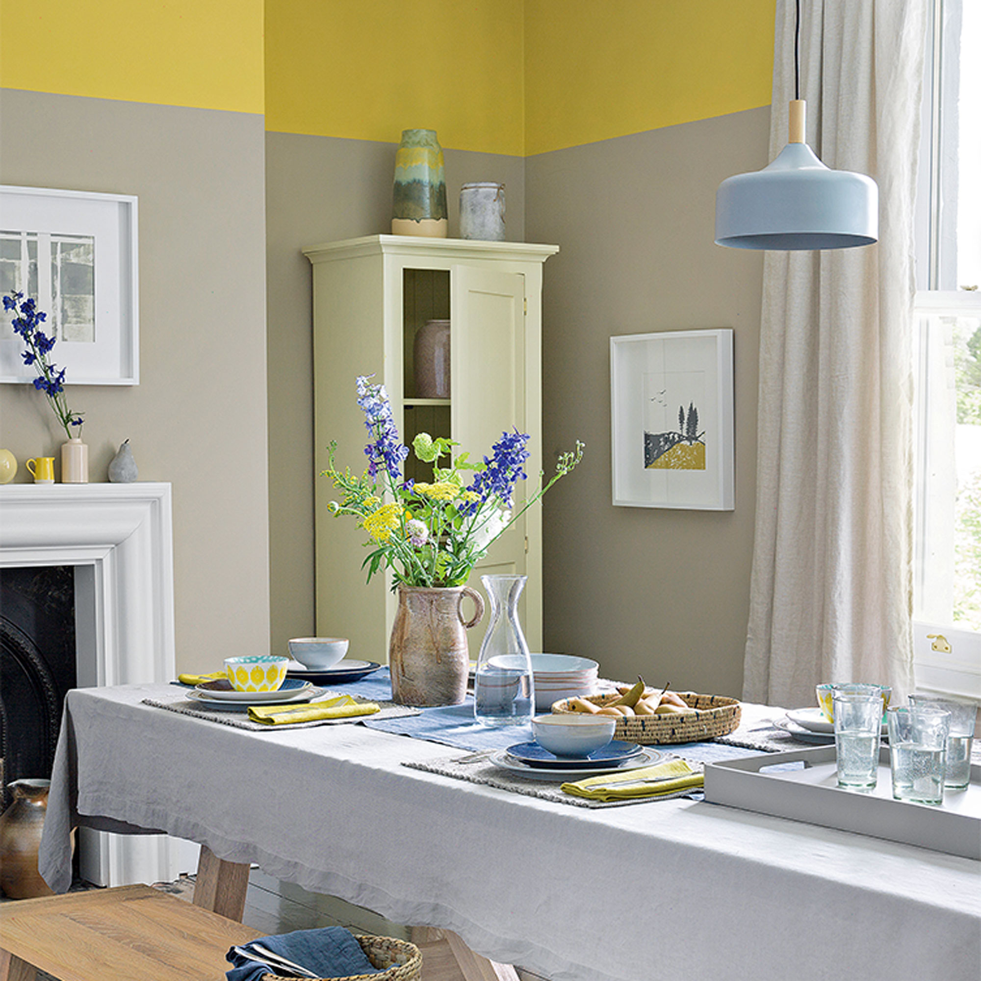 neutral dining room with yellow painted band