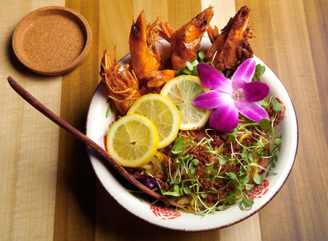 Palabok with shrimp and stir fried noodles is among the popular menu offerings at Purple Roots Filipino Fare + Panaderia, which features authentic Filipino cuisine from family recipies. 