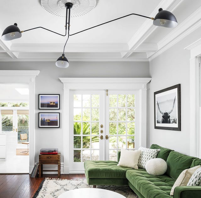 feng shui living room, light and airy living room with light gray walls and green velvet couch