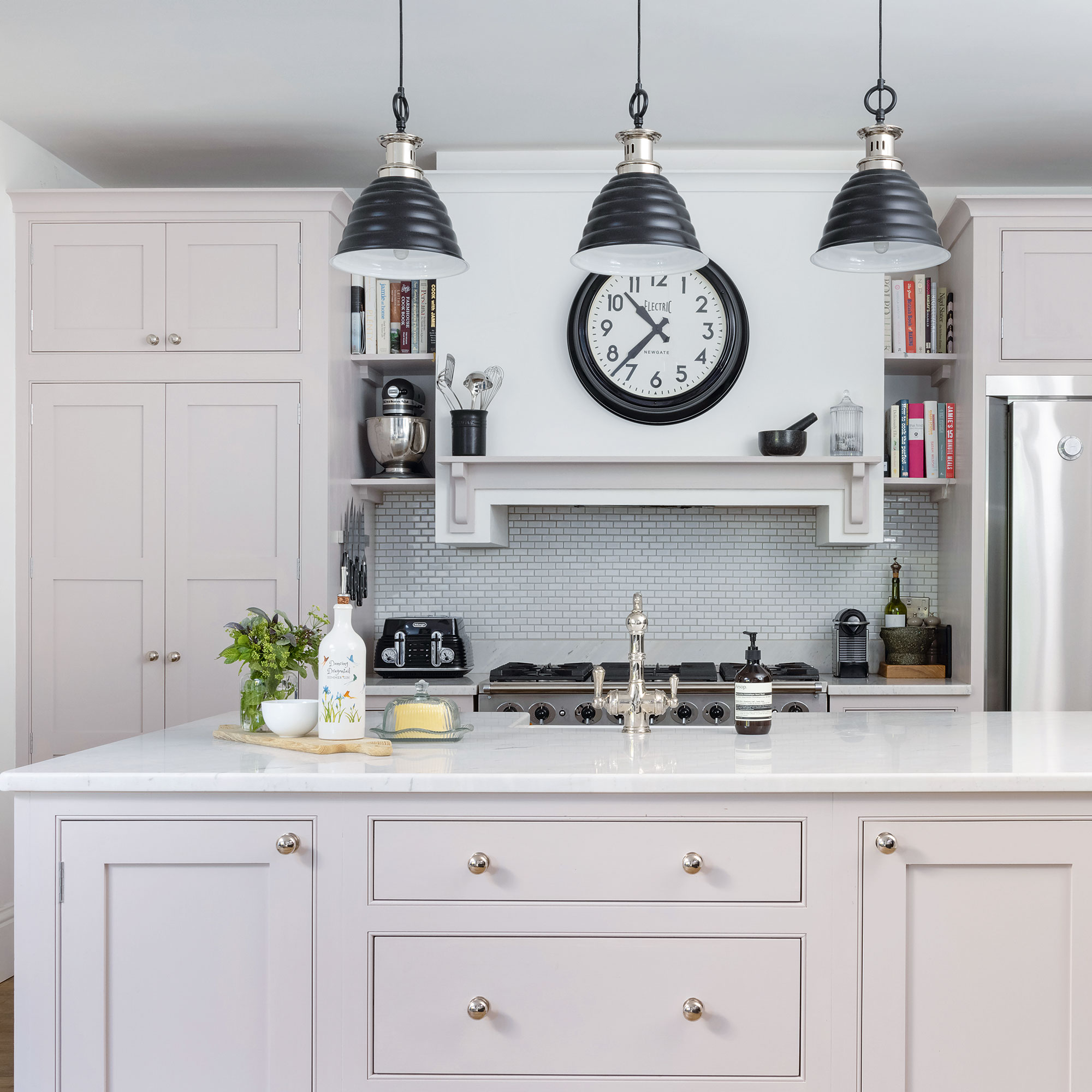 Georgian kitchen with pale pink cabinets and marble work top
